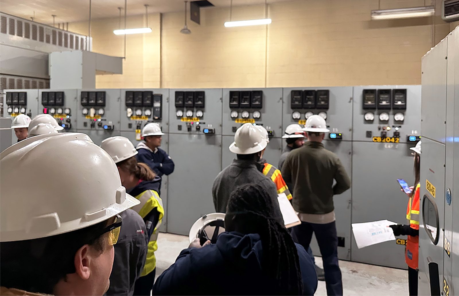 Field team inspecting substation switchgear